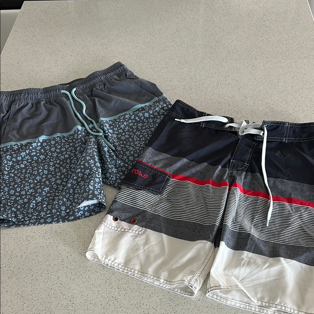 Two sets of teenage boy board shorts